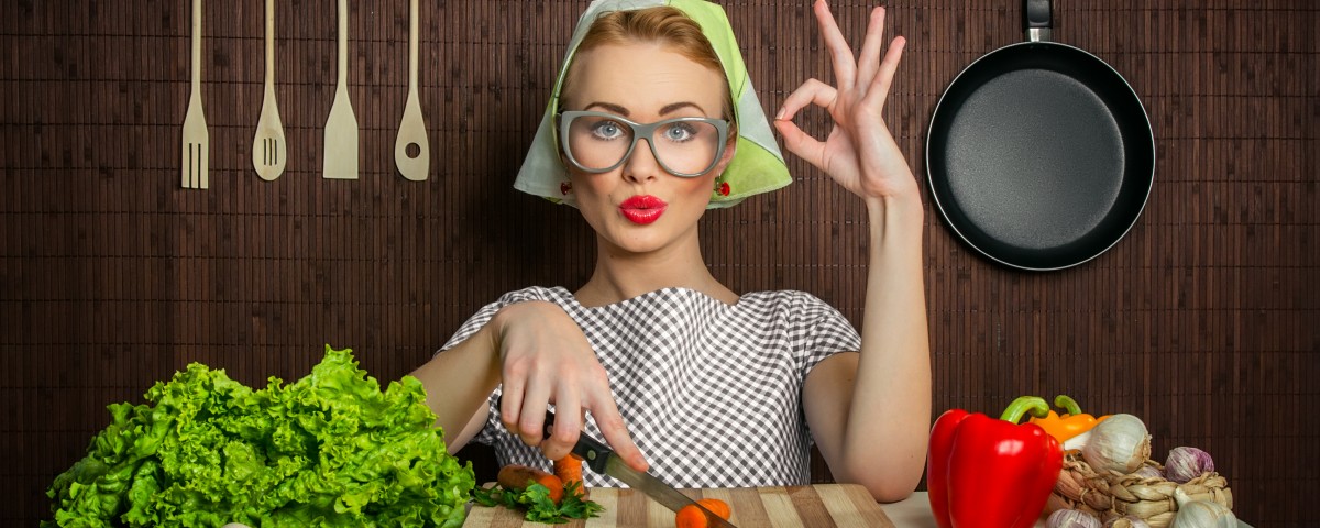 Happy woman cook with okay sign cut carrot-vintage concept