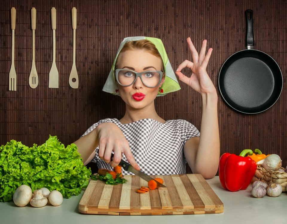 Happy woman cook with okay sign cut carrot-vintage concept